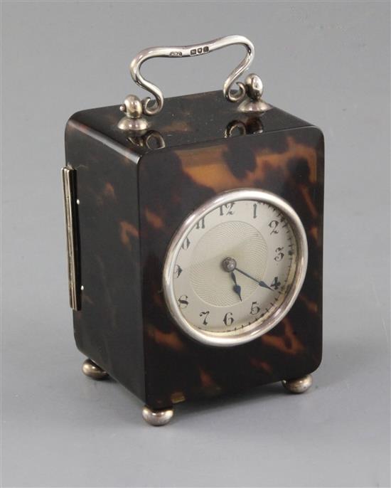 An Edwardian silver mounted tortoiseshell rectangular carriage timepiece, 11.5cm over handle.